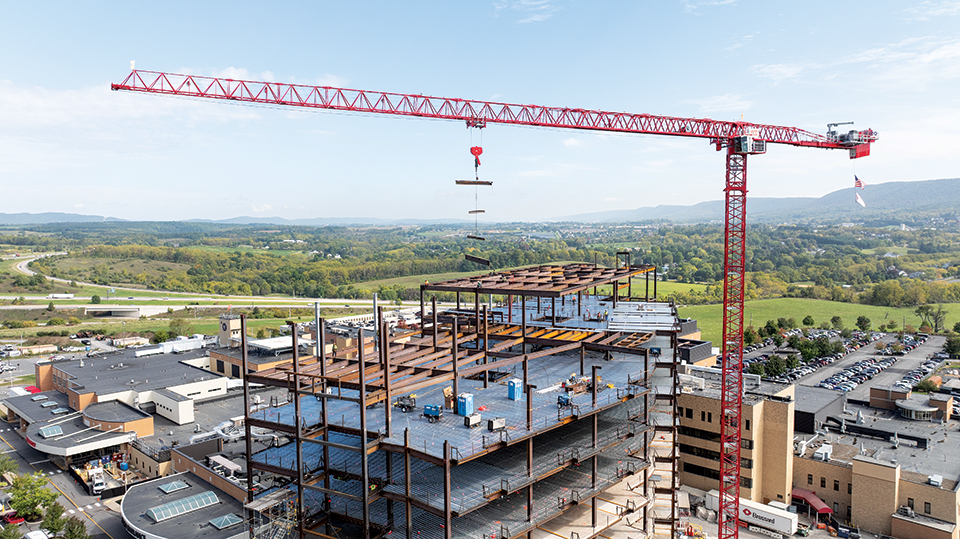 The Potain MDT 809 M40 tower crane is primarily used to lift steel beams and precast concrete